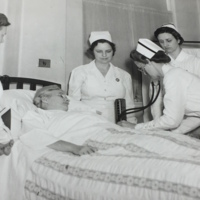 Nursing students with patient.JPG