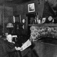 Carl Schmidt in front of his fireplace.jpg