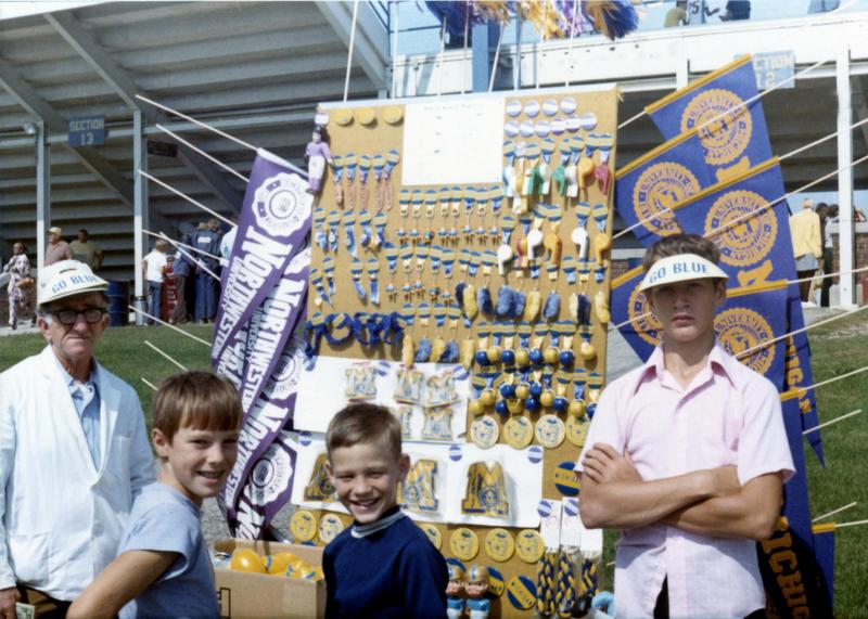 people selling souvenirs at football games.jpg